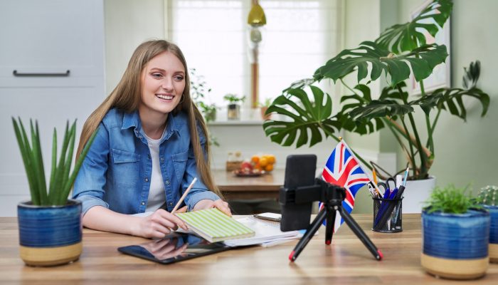 Online English lesson, young woman teaching English to students