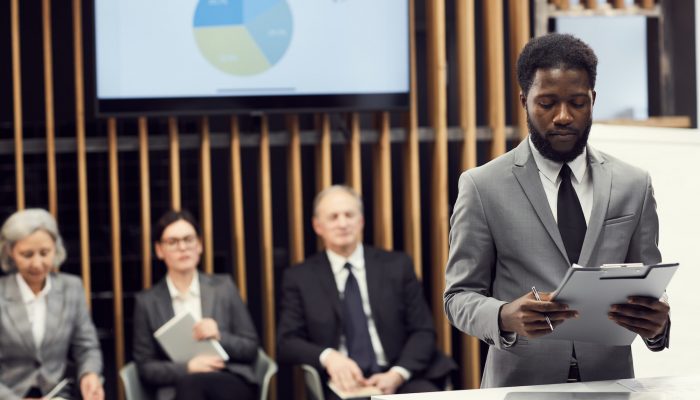 Young businessman preparing for public speech